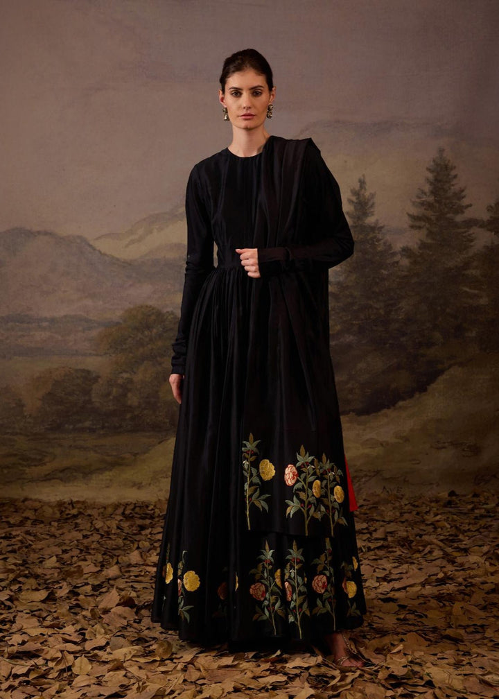 A sophisticated ensemble features a full-length black anarkali.