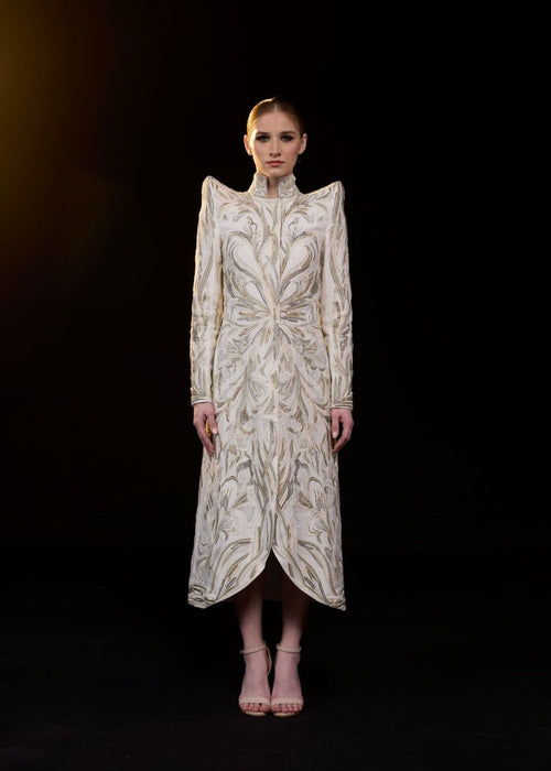 A sophisticated midi dress features a high neckline and long sleeve.