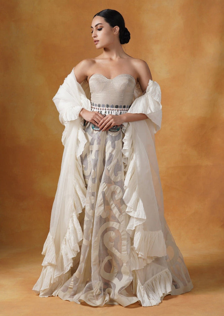A tube corset in cotton paired with an Ivory appliqué work skirt and organza Dupatta with cotton frill. - samantchauhan Apparel &amp; Accessories