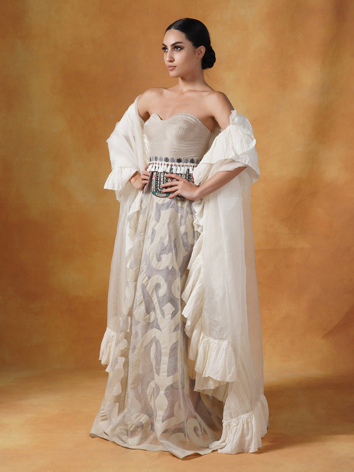 A tube corset in cotton paired with an Ivory appliqué work skirt and organza Dupatta with cotton frill. - samantchauhan Apparel &amp; Accessories