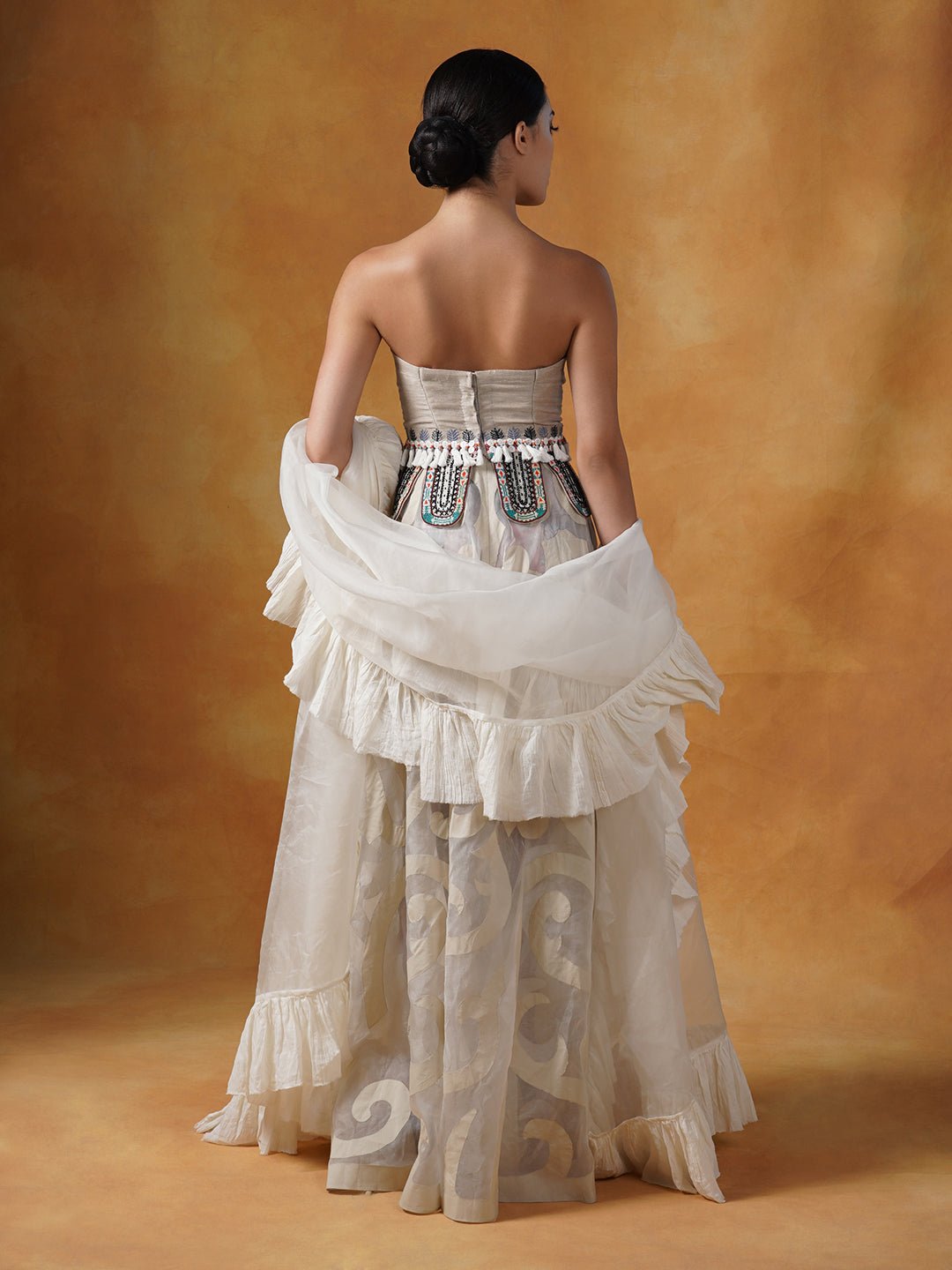 A tube corset in cotton paired with an Ivory appliqué work skirt and organza Dupatta with cotton frill. - samantchauhan Apparel &amp; Accessories
