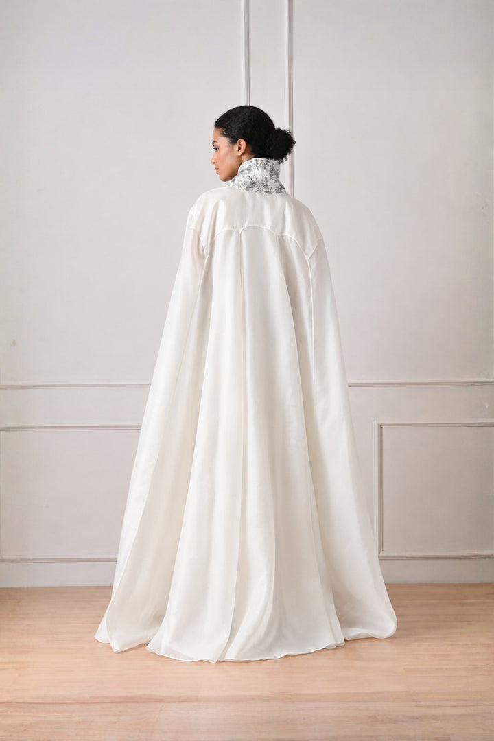 Ivory Front Open Cape With Embroidery Highlight On Neckline Paired With Dress