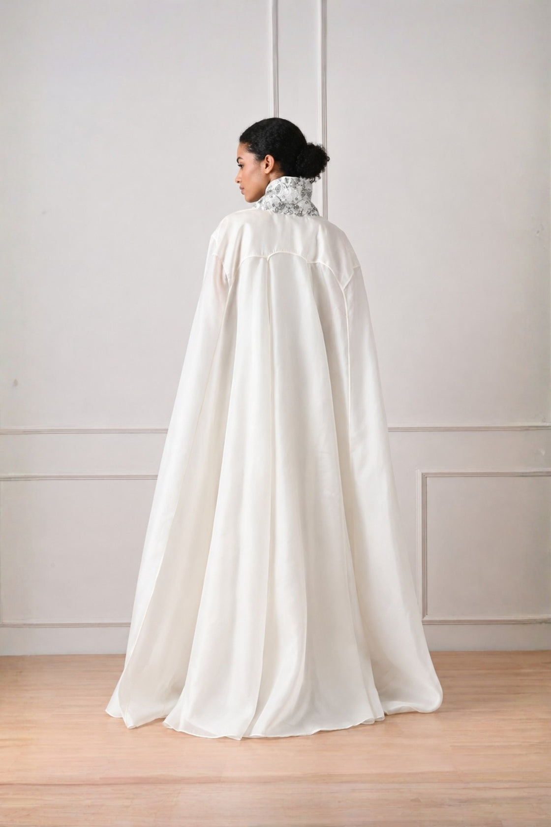 Ivory Front Open Cape With Embroidery Highlight On Neckline Paired With Dress