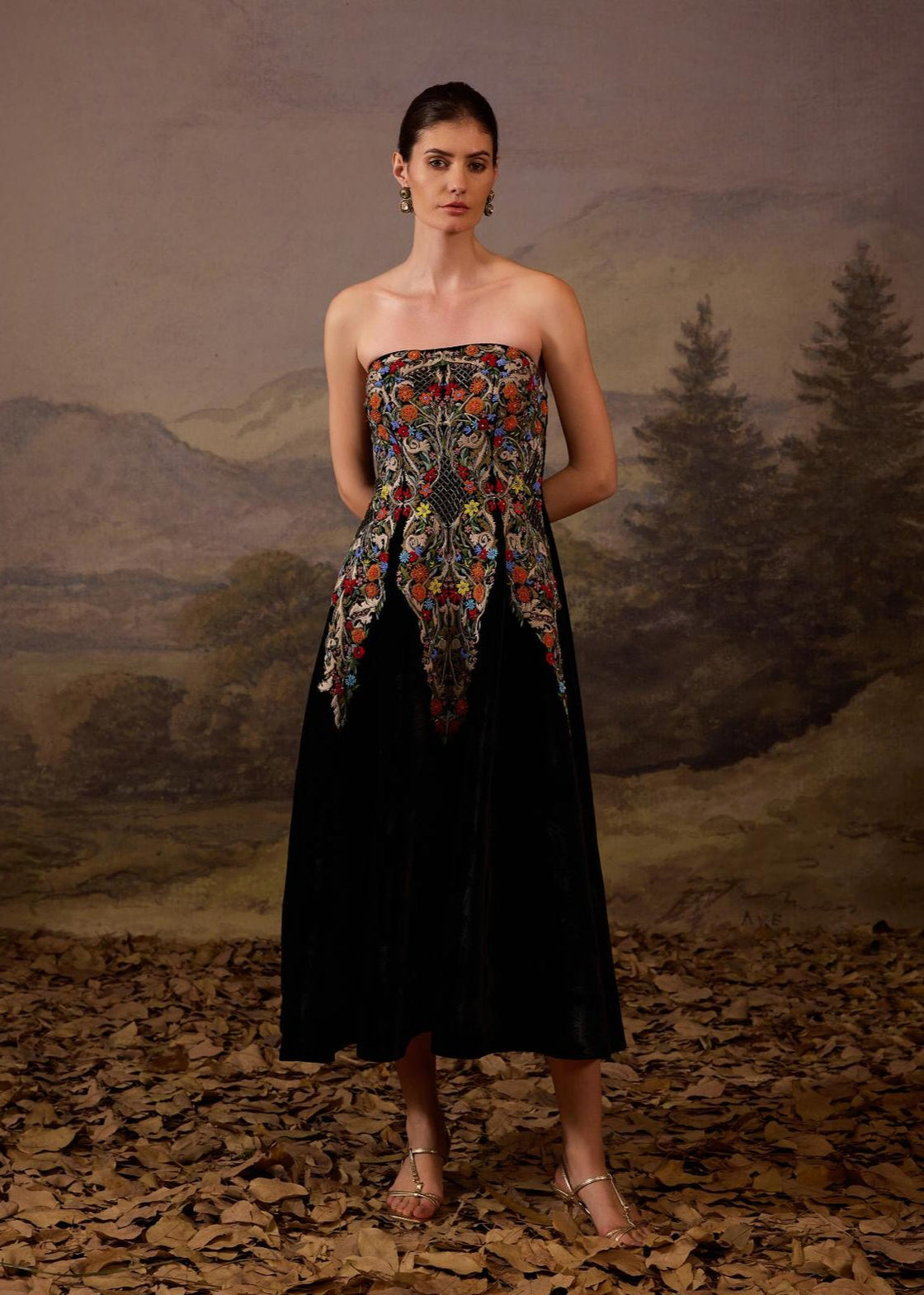 Chic black strapless dress with a multi embroidered bodice.