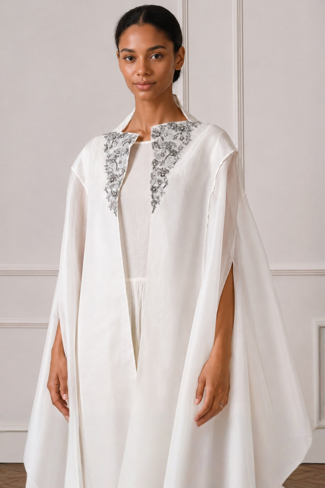 Ivory Front Open Cape With Embroidery Highlight On Neckline Paired With Dress
