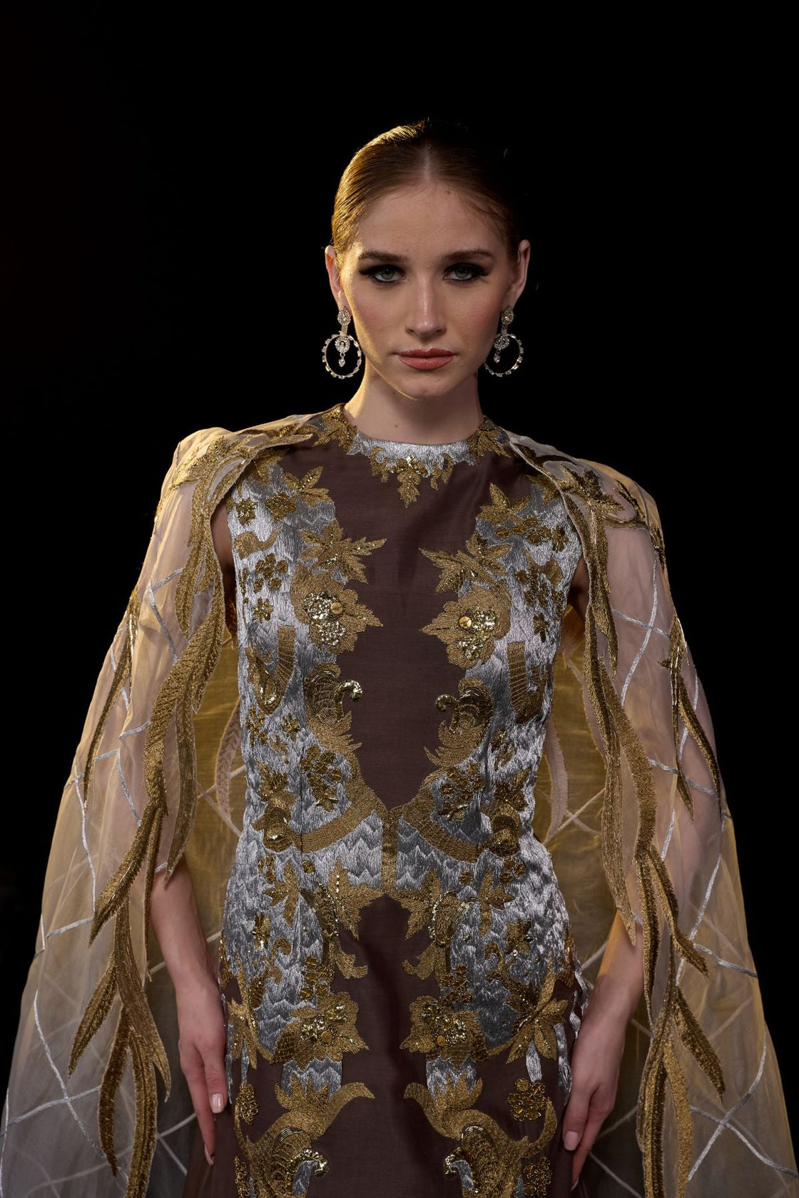 Embroidered Brown Gown with Sheer Cape.