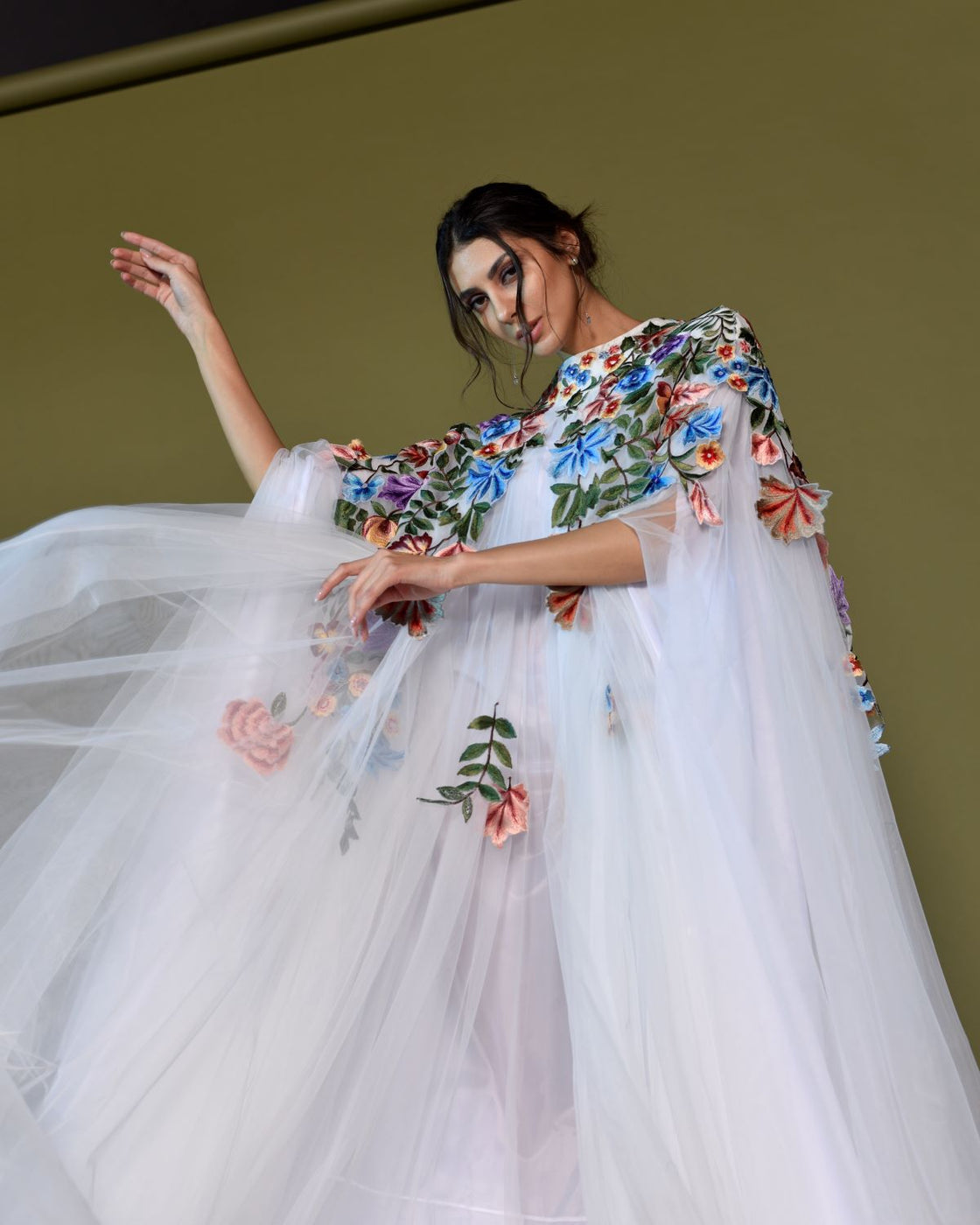 Ethereal White Tulle Gown with embroidered Floral Cape.