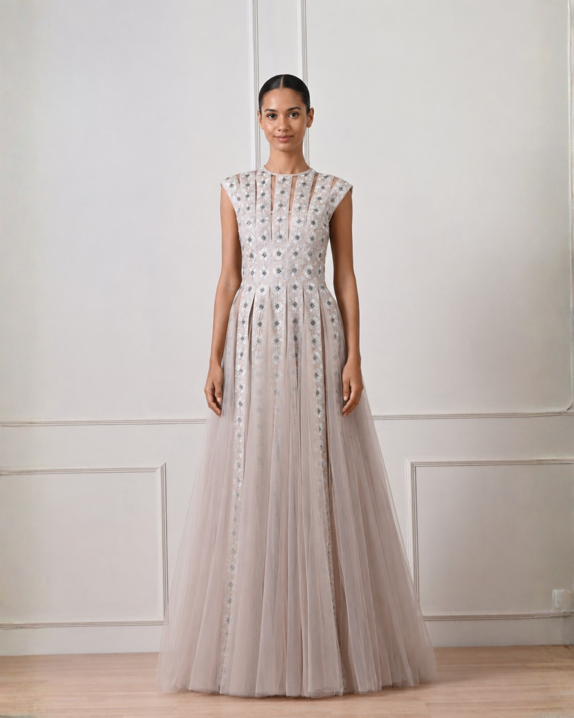 Woman wearing a long, elegant dress with a white background