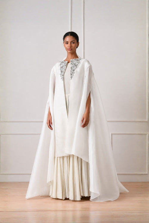 Ivory Front Open Cape With Embroidery Highlight On Neckline Paired With Dress