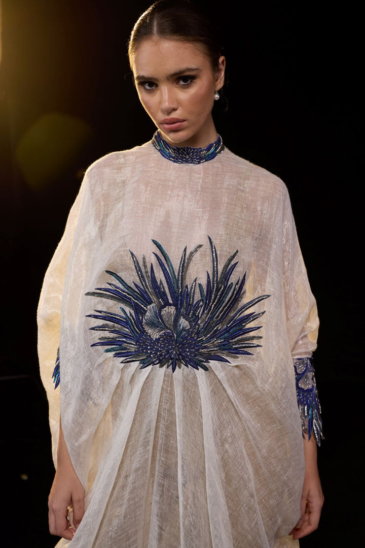 Ivory Draped Gown with Blue Embroidery.