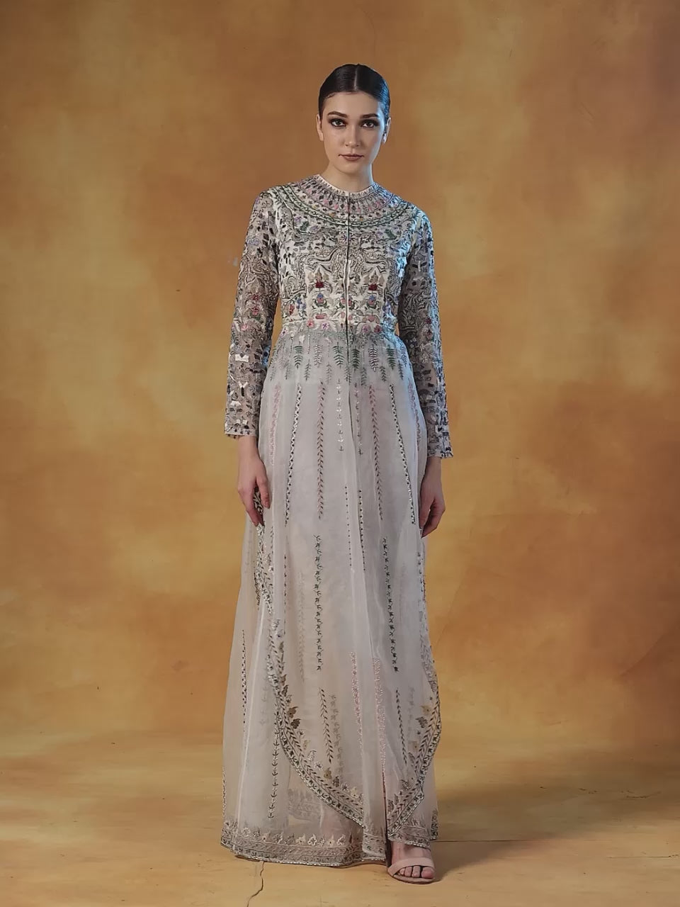 An organza jacket that is beautifully embroidered in silk yarns and pearl.