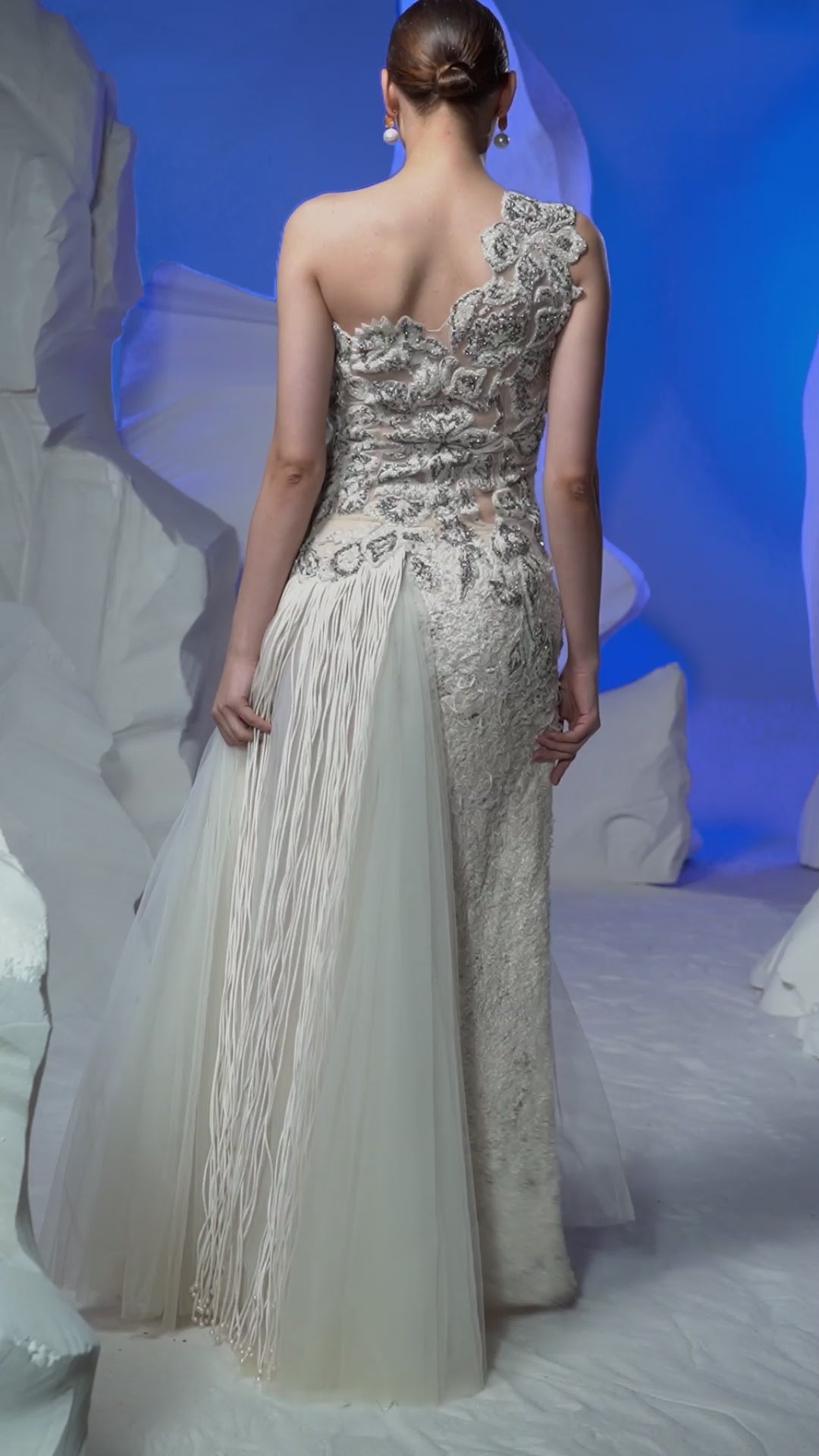 Ivory one-shoulder gown