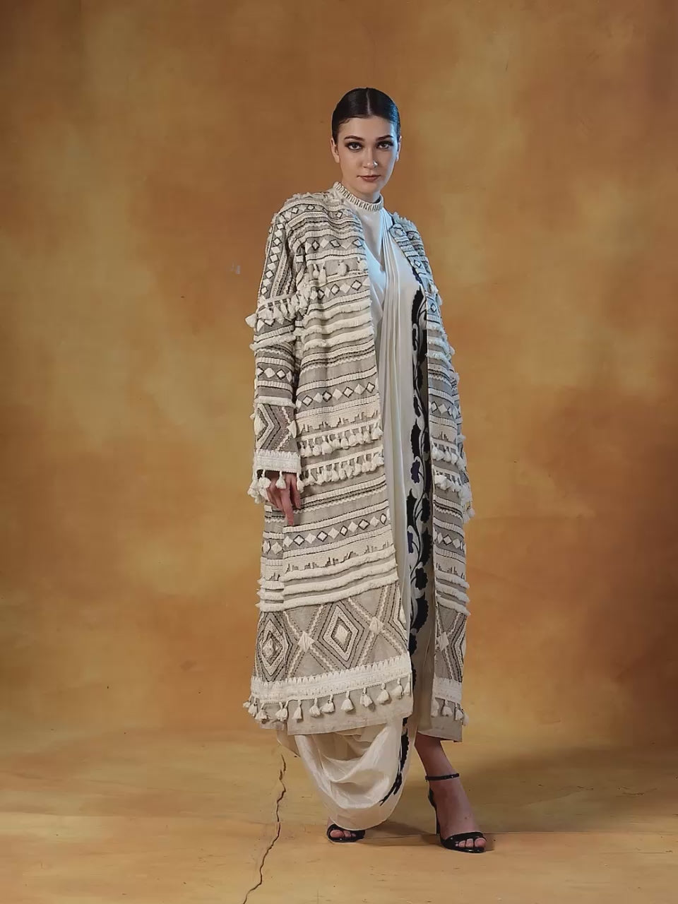Embroidered bohemian style long jacket in linen silk, topped on an ivory cotton silk drape dress