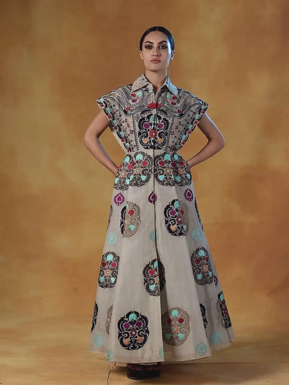 Featured here is a linen silk jacket style pleated