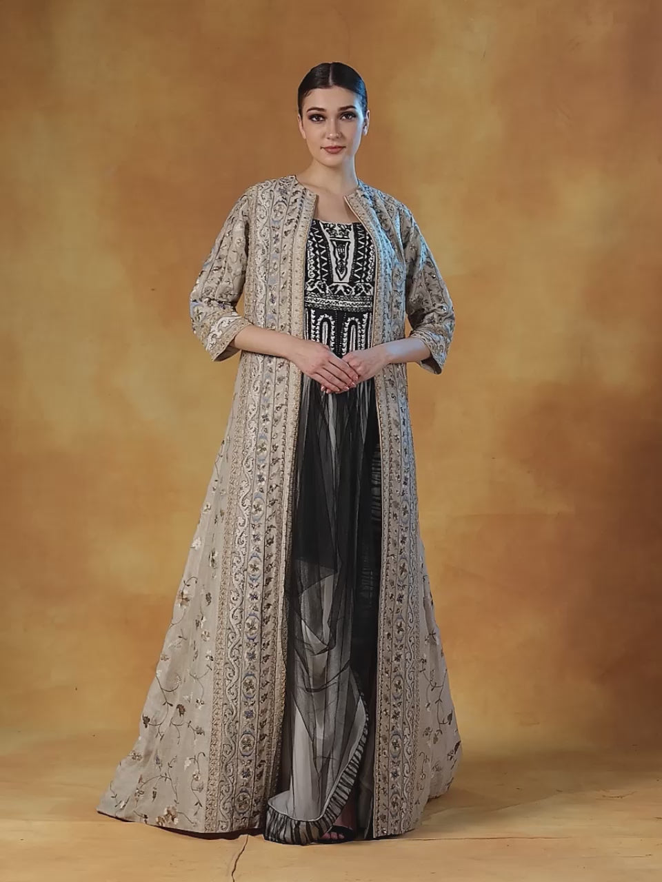 Linen silk jacket  topped over a net drape skirt and embellished crop top