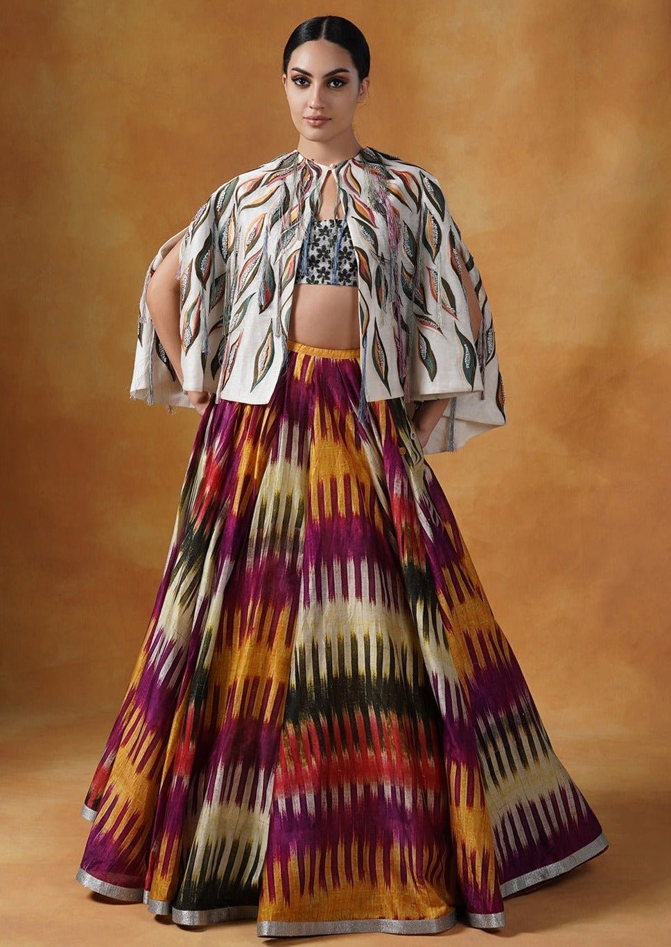 printed cotton silk skirt topped with an off - white cape style waist jacket covered with patchwork with a bustier inside - samantchauhan Apparel & Accessories