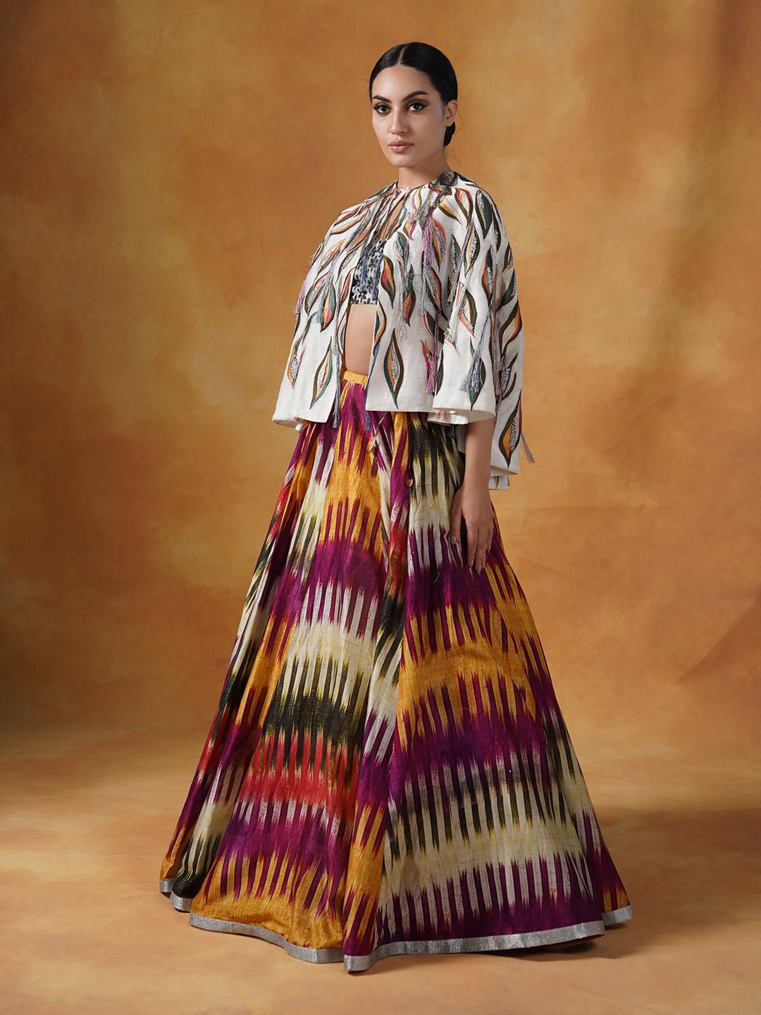 printed cotton silk skirt topped with an off - white cape style waist jacket covered with patchwork with a bustier inside - samantchauhan Apparel & Accessories