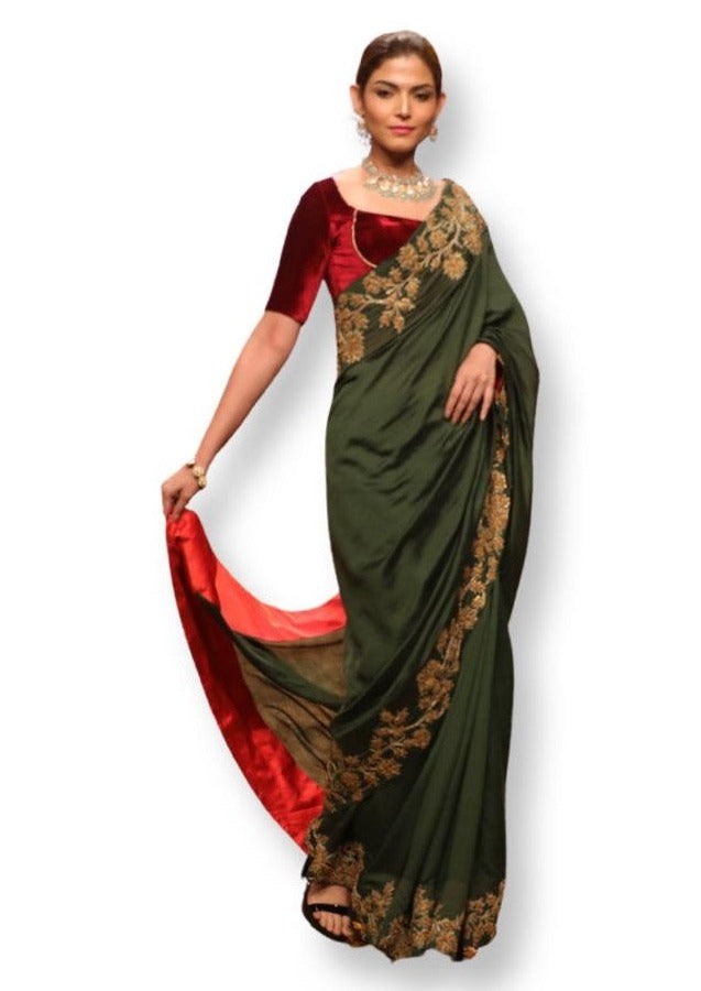 Green cotton silk saree decorated in Golden French knot embroidery with maroon blouse