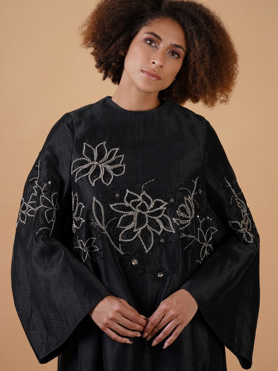 A lose-fit black cotton silk dress with silver embroidery flowers beautifully yoke
