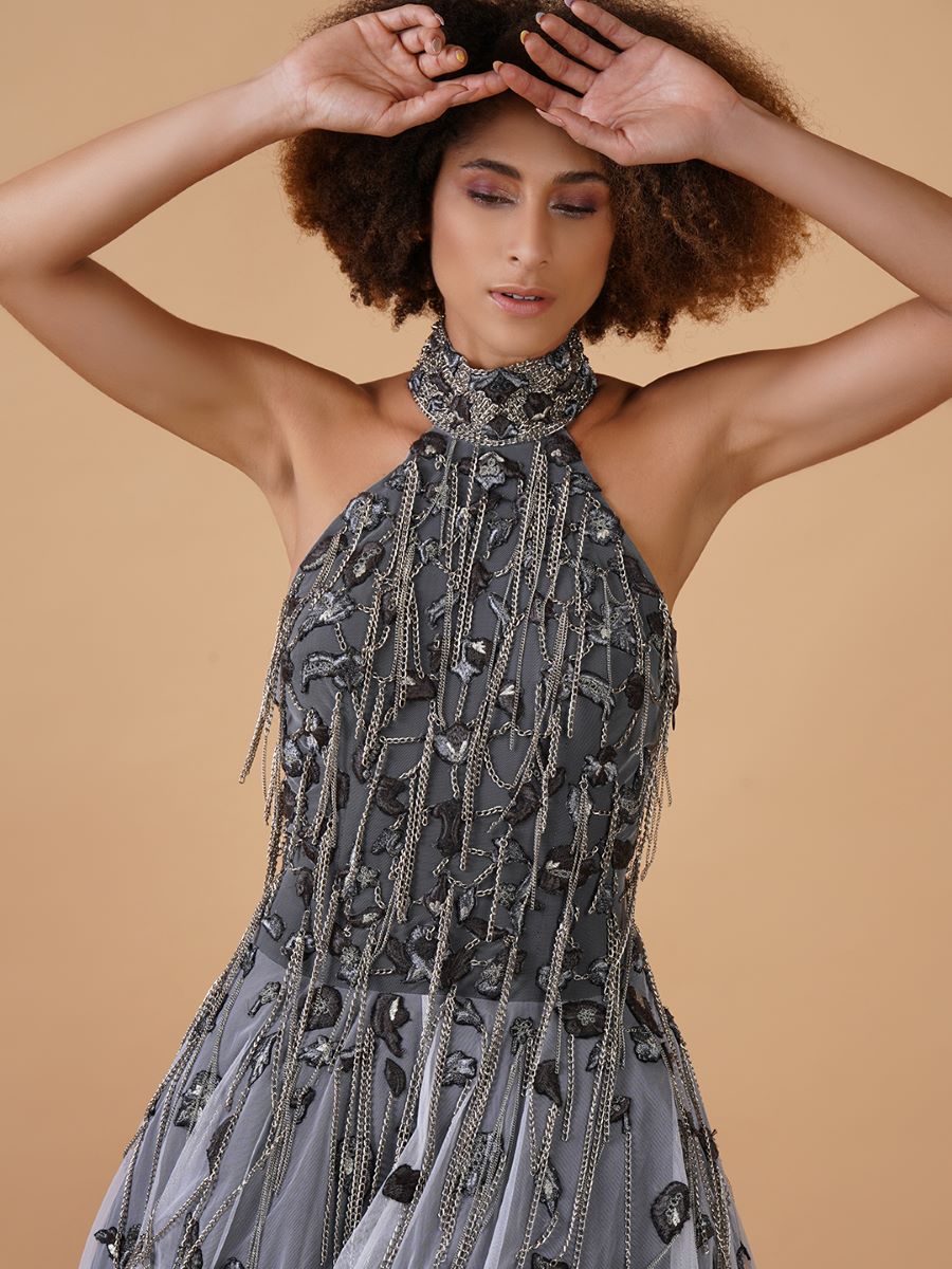 A gorgeous A-line dress in net, showcasing heavy, beautiful zardosi embroidery