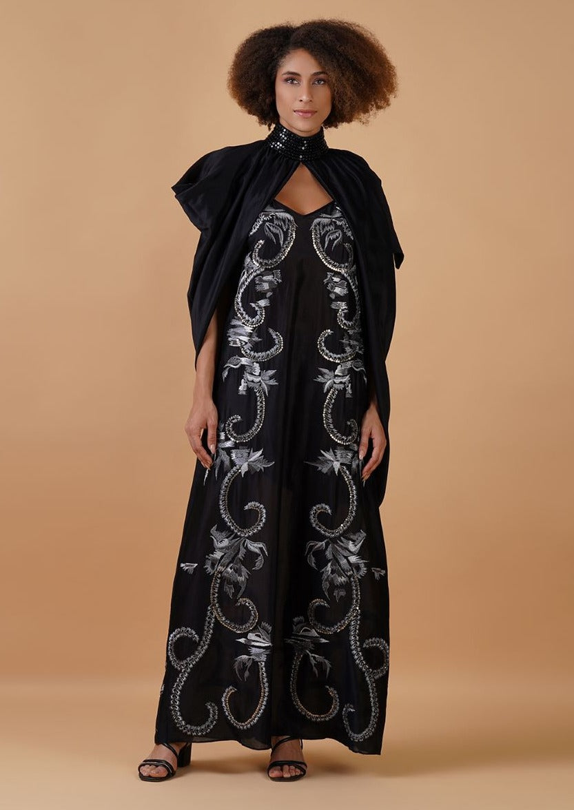 A long black cotton silk dress that has panels of silver zari embroideries