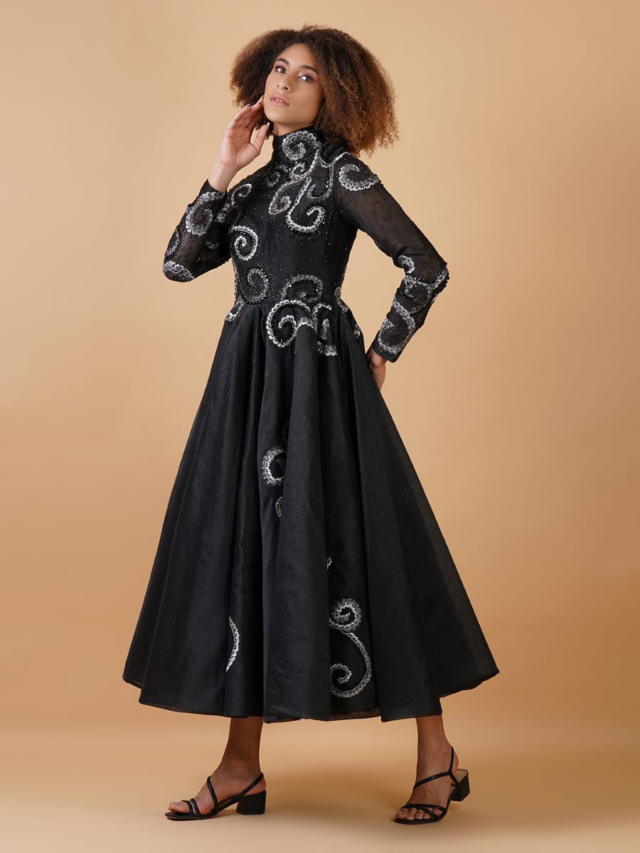 A chique A-line black cotton silk dress with a high neck and full sleeves