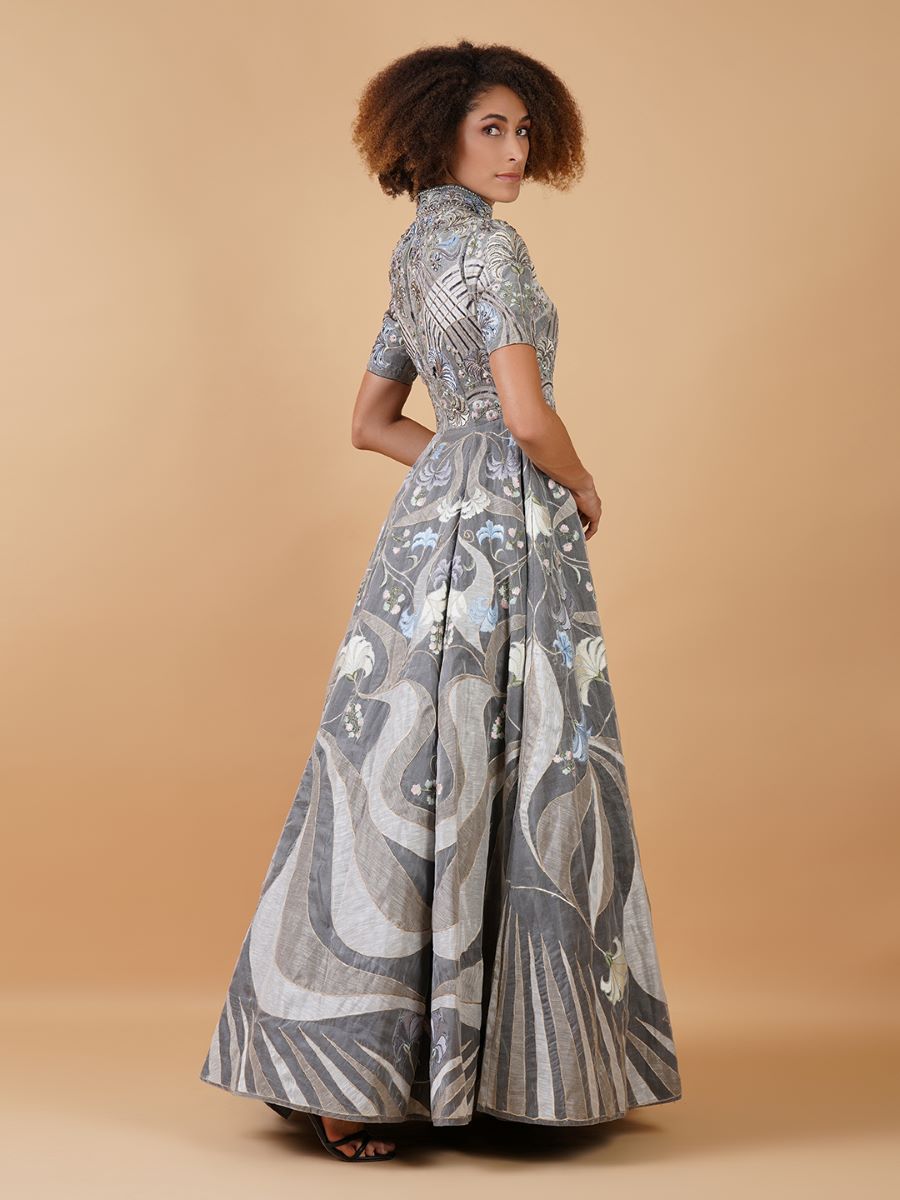 Featured here is a high-neck fit, A-line floor length gown