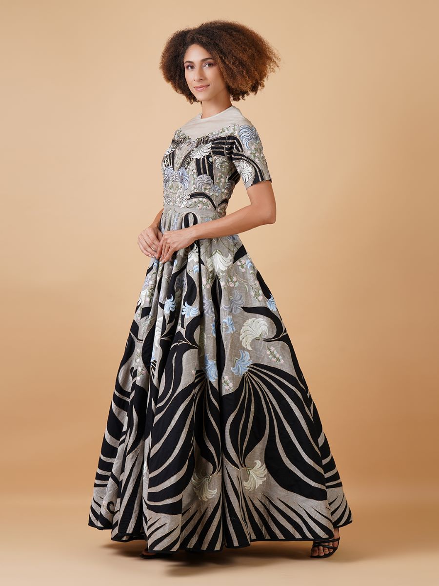 Featured here is a high-neck fit, A-line floor length gown