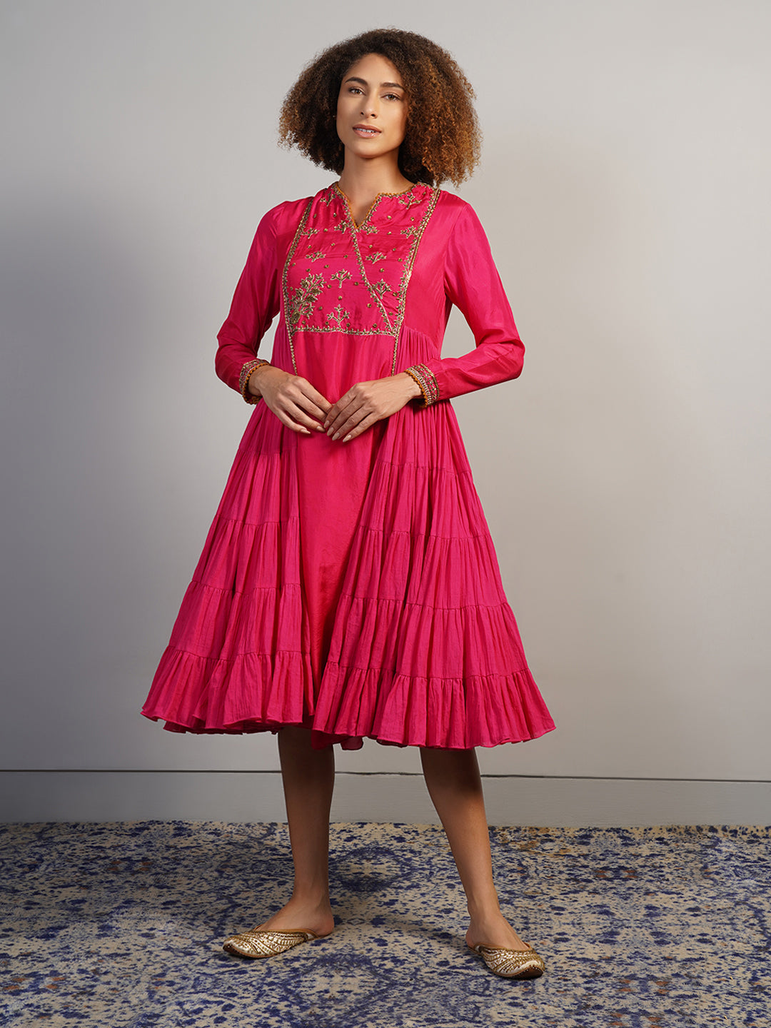 An A-line, tiered kurta in cotton along with silk sleeves