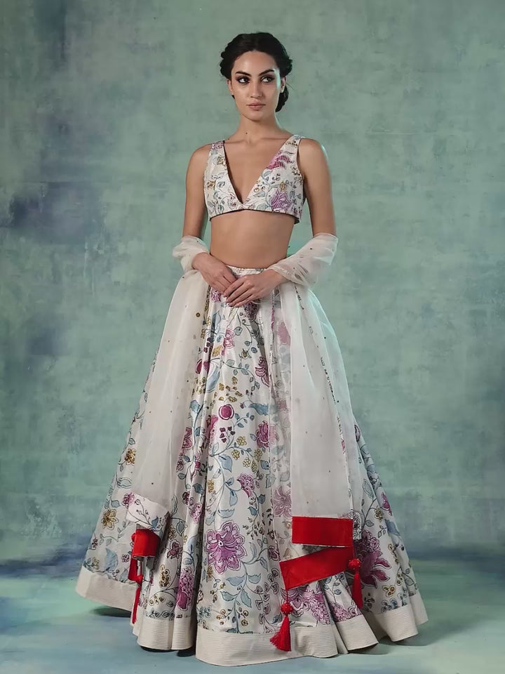 A Printed Cotton Silk Lehenga Set With Organza Dupatta.