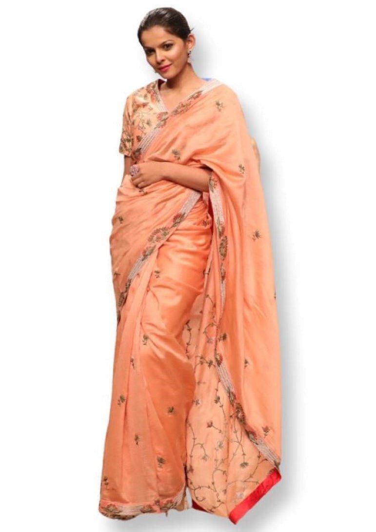 Peach Cotton silk saree and blouse that are embroidered in zari. - samantchauhan
