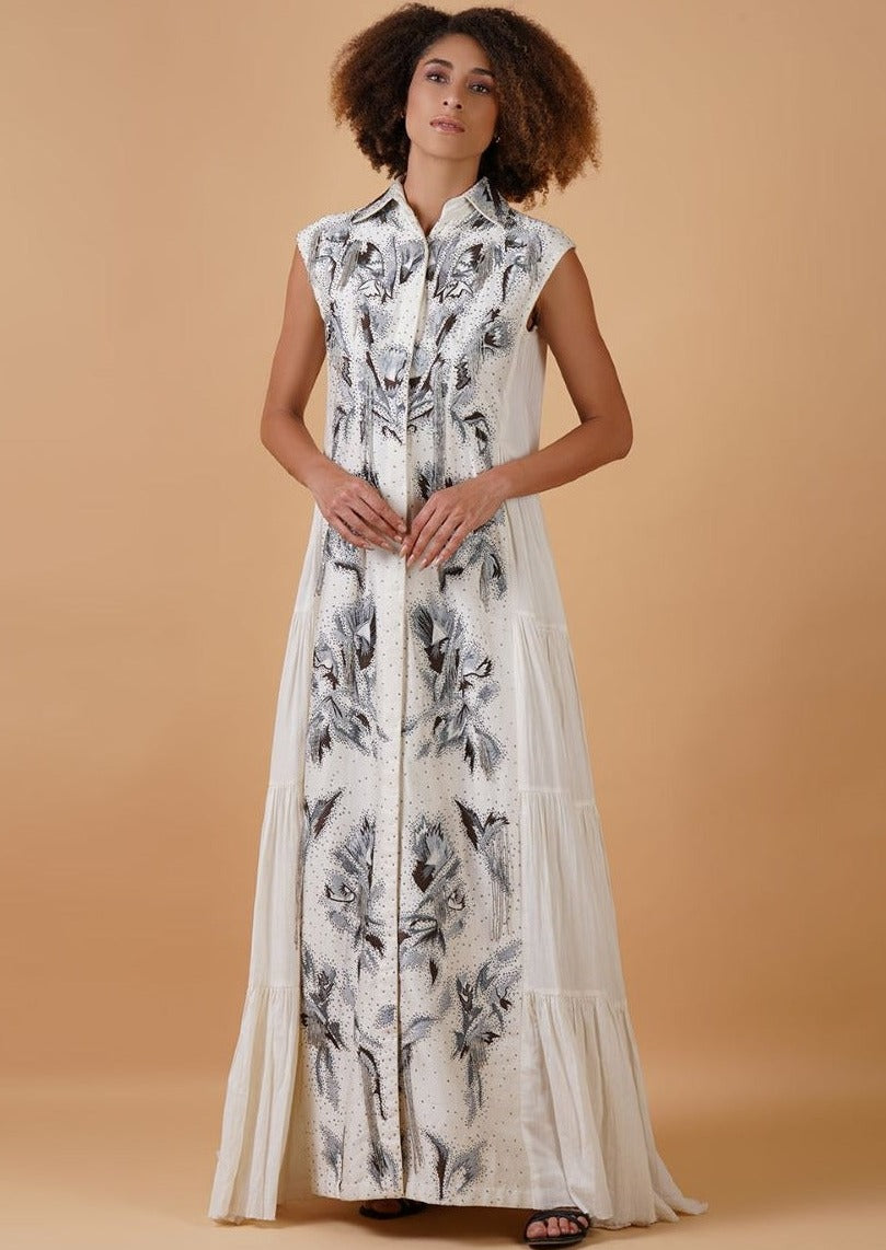 A white cotton tier dress with an embroidered chanderi panel in the front
