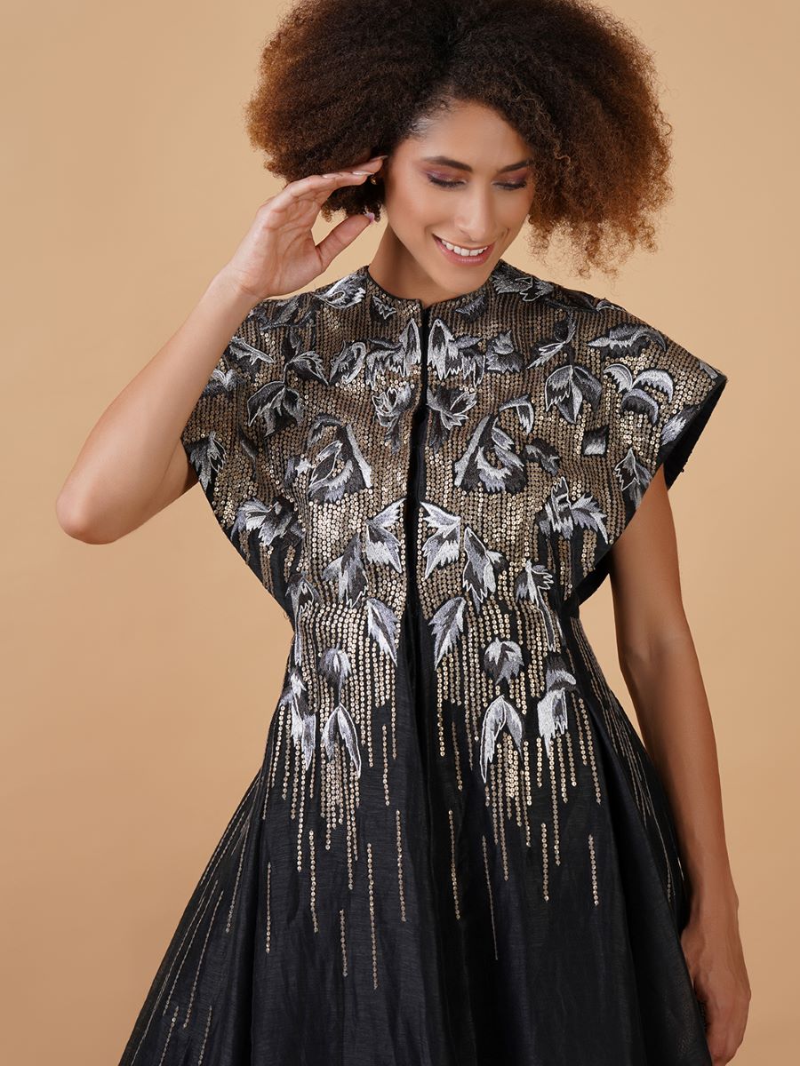 A black cotton silk jacket gown with sturdy and extended shoulders