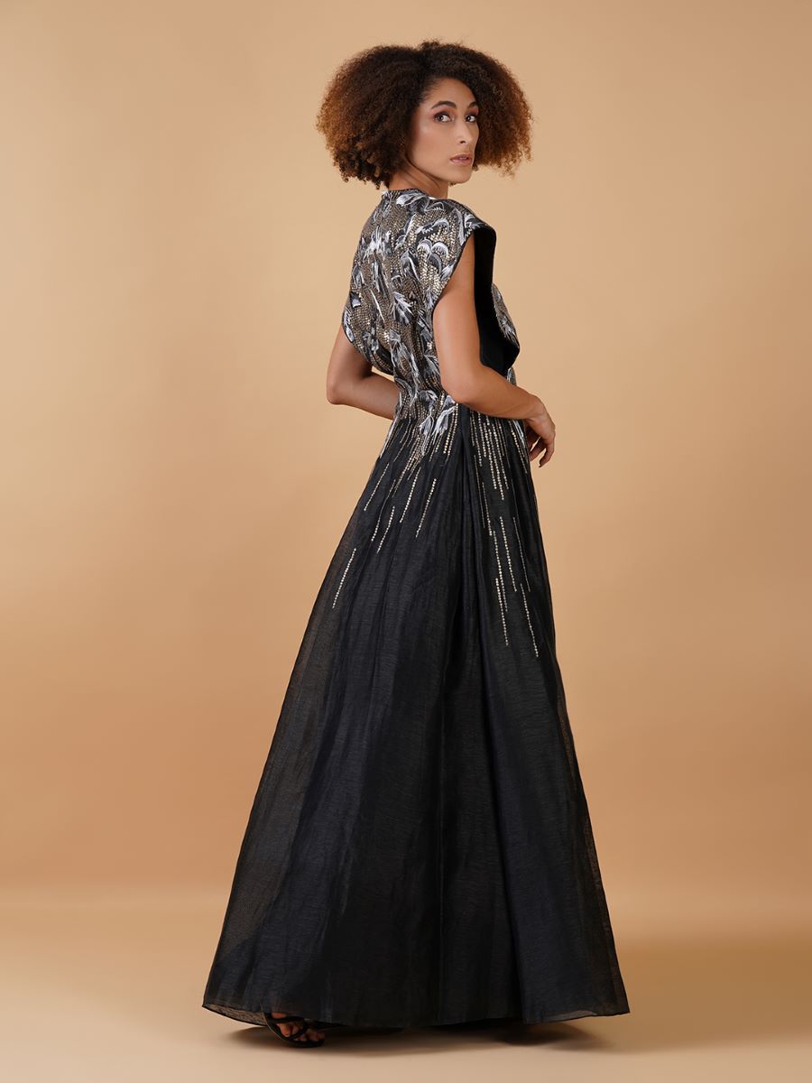 A black cotton silk jacket gown with sturdy and extended shoulders